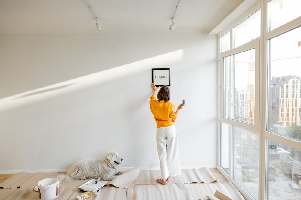 Woman setting up a picture frame